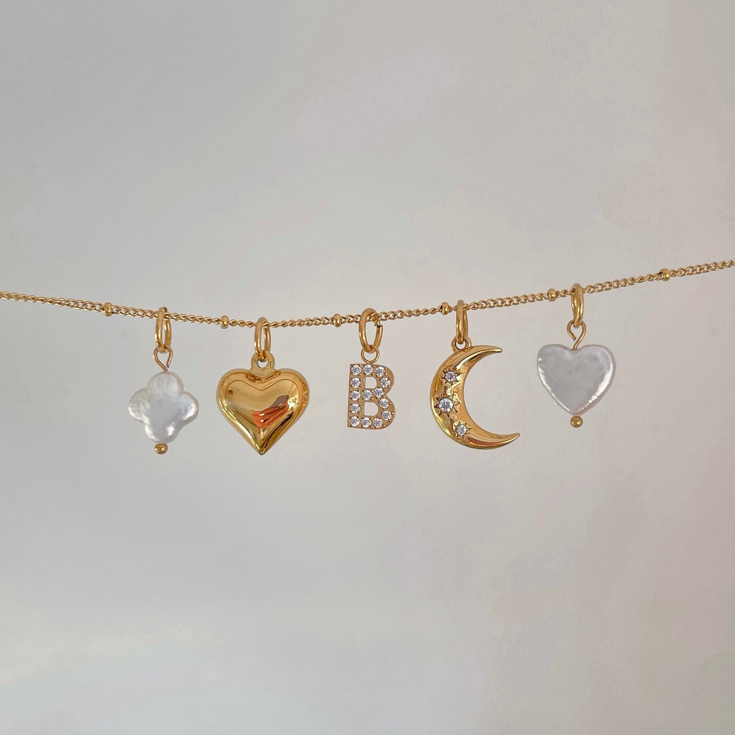 Pave Initial Charm