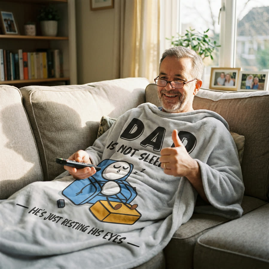Dad wrapped in the blanket, thumbs up